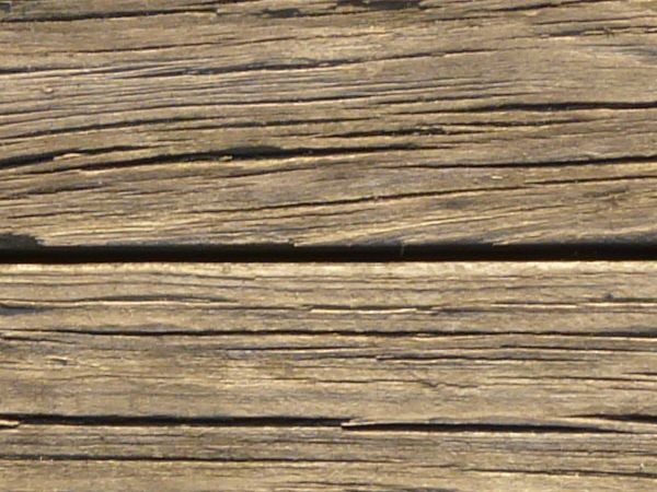 Old brown planks set evenly and horizontally.